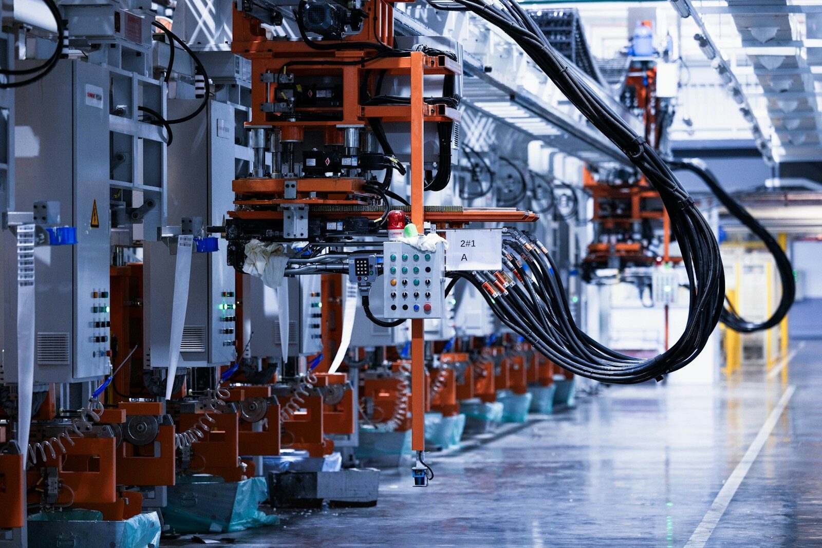 Photo by Homa Appliances a line of electrical equipment in a factory