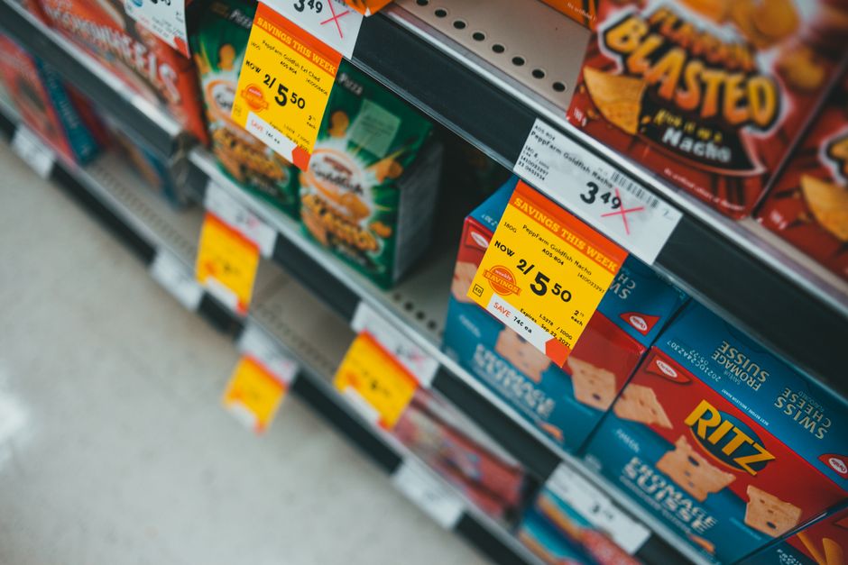 Promotional prices for items on a grocery store shelf