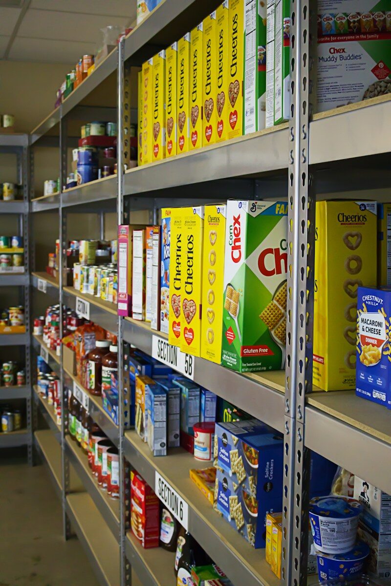 A shelf in a store filled with lots of food